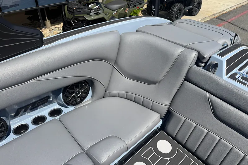 Slide: The Image of Luxurious seating in the 2026 MB B52 23 Alpha boat, featuring sleek gray upholstery. - 19