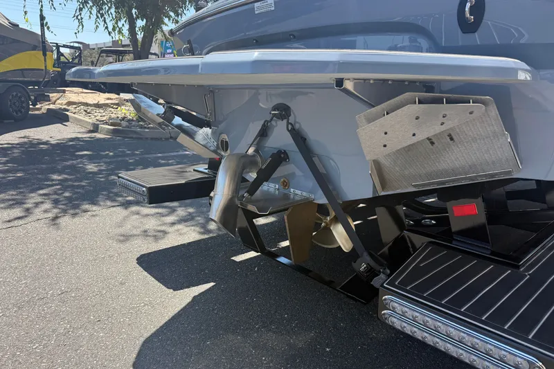 Slide: The Image of Rear view of 2026 MB B52 23 Alpha boat showcasing propeller and trim tabs. - 12