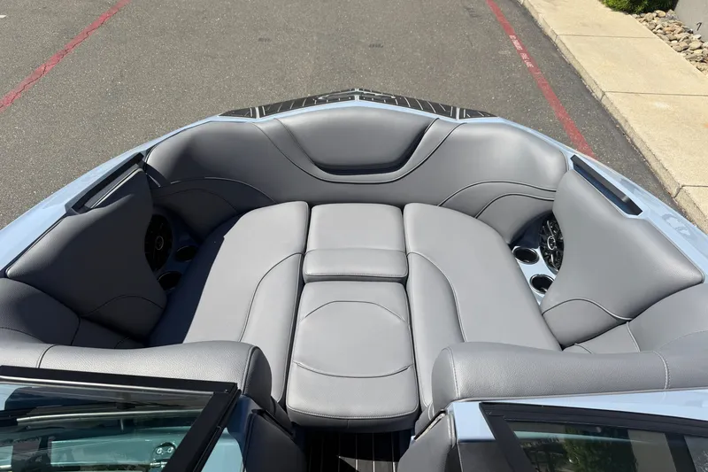 Slide: The Image of Luxurious interior of 2026 MB B52 23 Alpha boat with gray seating and cup holders. - 25