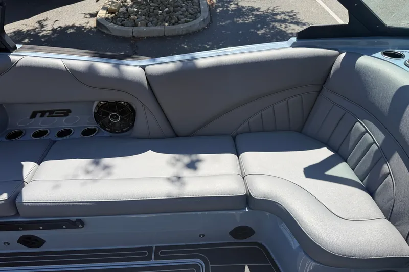 Slide: The Image of Luxurious seating in the 2026 MB B52 23 Alpha boat, featuring sleek gray upholstery. - 23