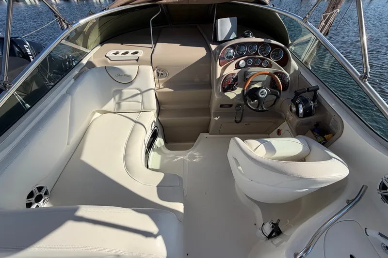 Slide: The Image of 2001 Sea Ray Sundancer 280 cockpit with steering wheel, seating, and control panel. - 14