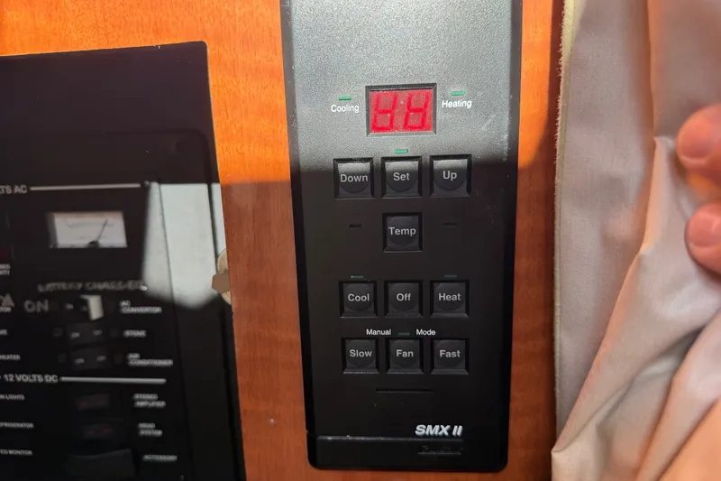 Slide: The Image of Control panel of a 2001 Sea Ray Sundancer 280 boat, displaying temperature settings. - 29