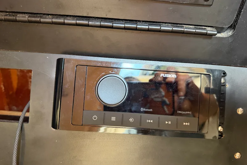 Slide: The Image of Fusion audio system on 2001 Sea Ray Sundancer 280 boat dashboard. - 30