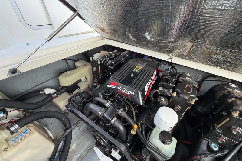 Slide: The Image of Engine compartment of a 2001 Sea Ray Sundancer 280 with a 4.3L Mercury engine. - 25