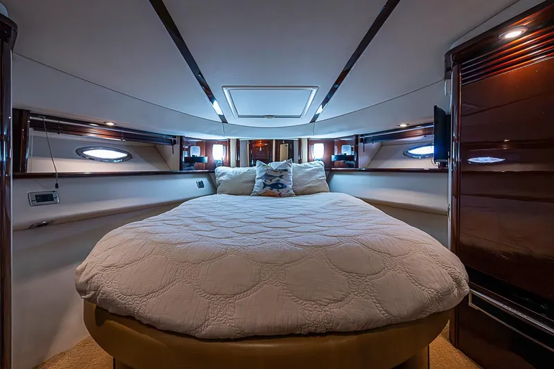 Slide: The Image of Luxurious bedroom interior of 2010 Sea Ray 520 Sedan Bridge yacht. - 51