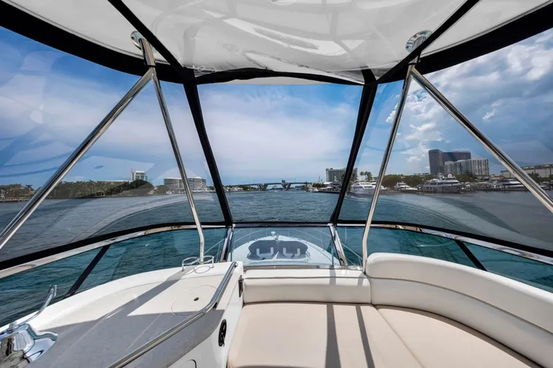 Slide: The Image of View from 2010 Sea Ray 52 Sedan Bridge yacht, overlooking marina and cityscape. - 77