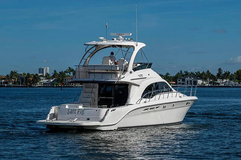 Slide: The Image of 2010 Sea Ray 520 Sedan Bridge yacht cruising on a sunny day. - 7