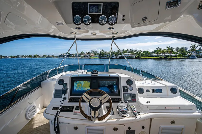 Slide: The Image of Cockpit view of 2010 Sea Ray 520 Sedan Bridge yacht with navigation equipment. - 34