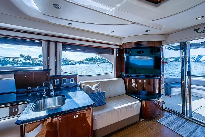 Slide: The Image of Luxurious interior of 2010 Sea Ray 520 Sedan Bridge yacht with modern amenities and waterfront view. - 40