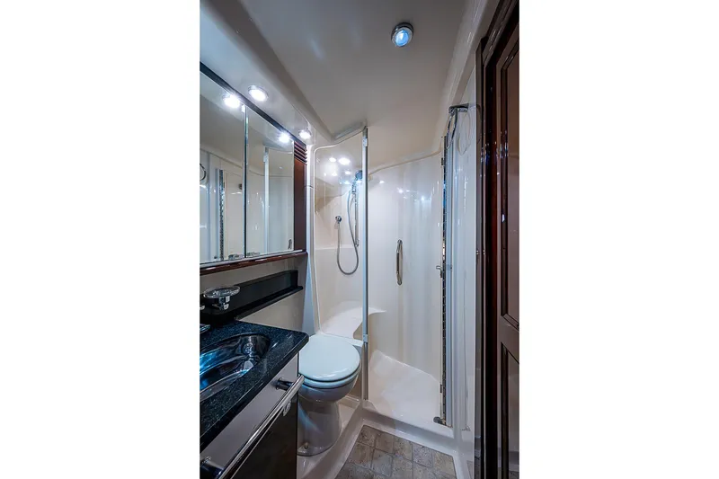 Slide: The Image of Luxurious bathroom in 2010 Sea Ray 520 Sedan Bridge yacht, featuring modern fixtures and elegant design. - 56