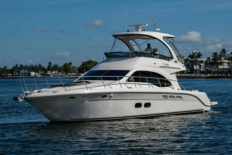 Slide: The Image of 2010 Sea Ray 520 Sedan Bridge yacht cruising on a sunny day. - 8