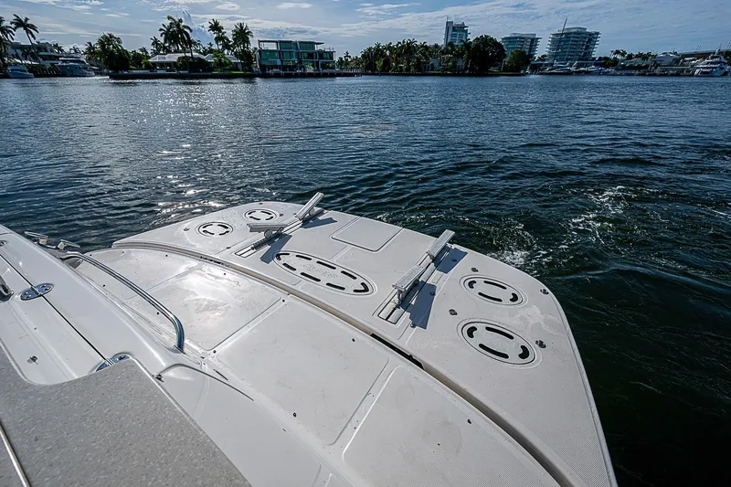 Slide: The Image of 2010 Sea Ray 520 Sedan Bridge yacht on calm waters, showcasing the spacious deck. - 60