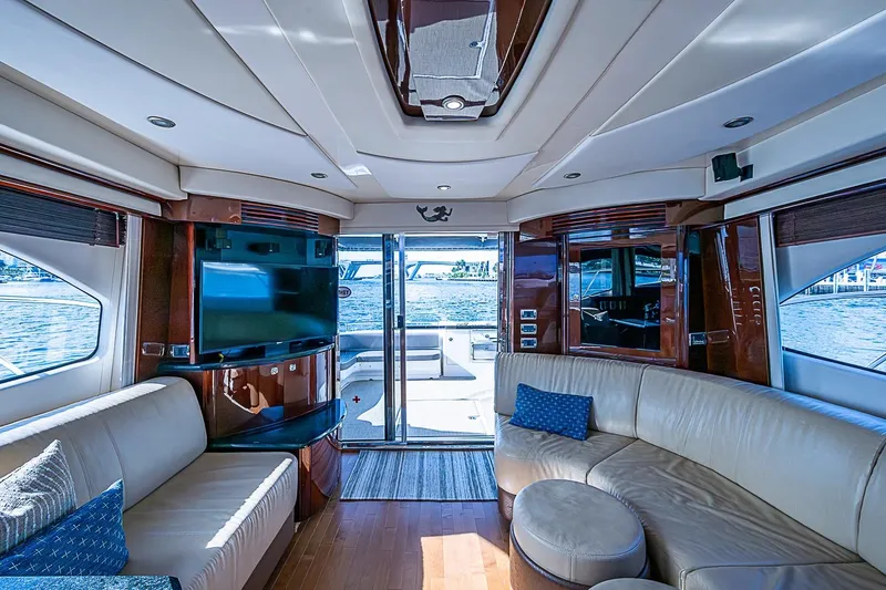 Slide: The Image of Luxurious interior of 2010 Sea Ray 520 Sedan Bridge yacht with plush seating and waterfront view. - 41