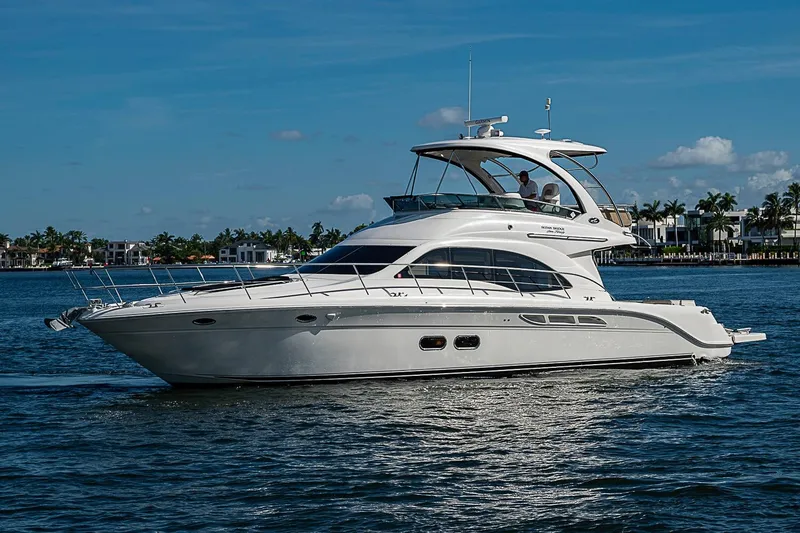Slide: The Image of 2010 Sea Ray 520 Sedan Bridge yacht cruising on a sunny day. - 5