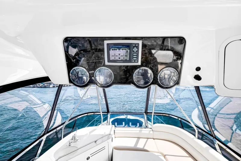 Slide: The Image of 2010 Sea Ray 52 Sedan Bridge helm with gauges and ocean view. - 70