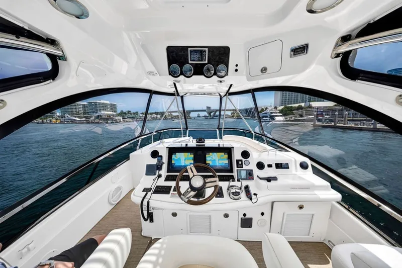 Slide: The Image of Cockpit view of 2010 Sea Ray 52 Sedan Bridge yacht with navigation equipment. - 42