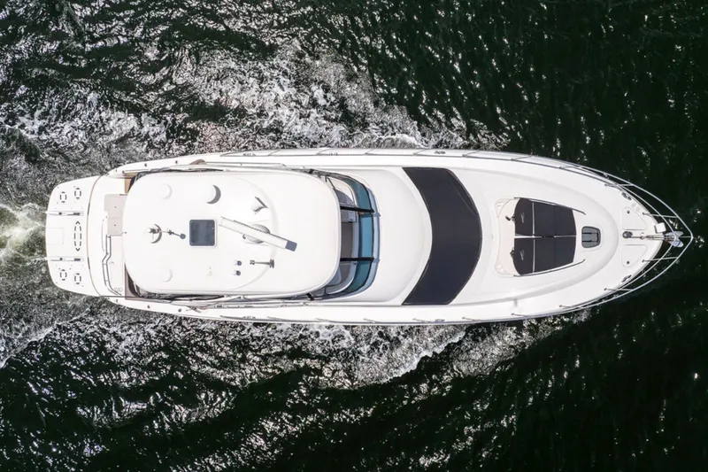 Slide: The Image of Aerial view of 2010 Sea Ray 52 Sedan Bridge yacht cruising on water. - 78