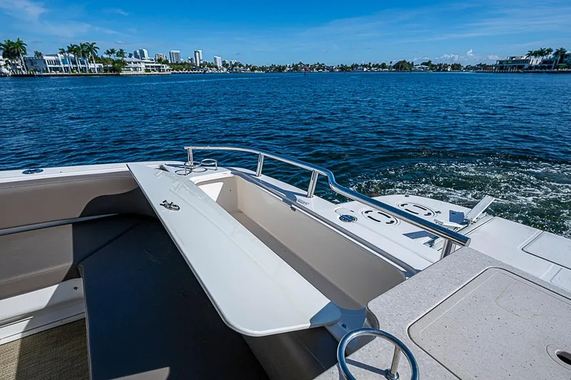 Slide: The Image of 2010 Sea Ray 520 Sedan Bridge yacht on calm waters, showcasing luxurious deck and scenic view. - 14