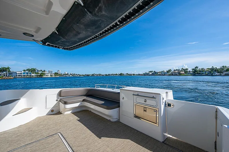 Slide: The Image of Luxurious 2010 Sea Ray 520 Sedan Bridge yacht deck with waterfront view. - 30