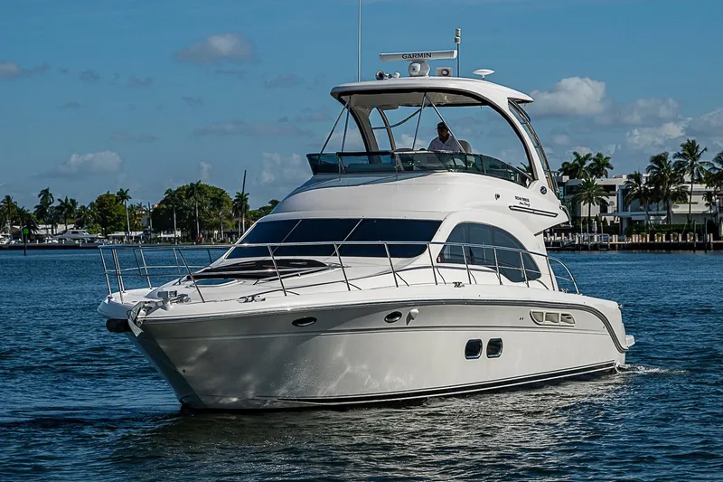 Slide: The Image of 2010 Sea Ray 520 Sedan Bridge yacht cruising on a sunny day. - 4