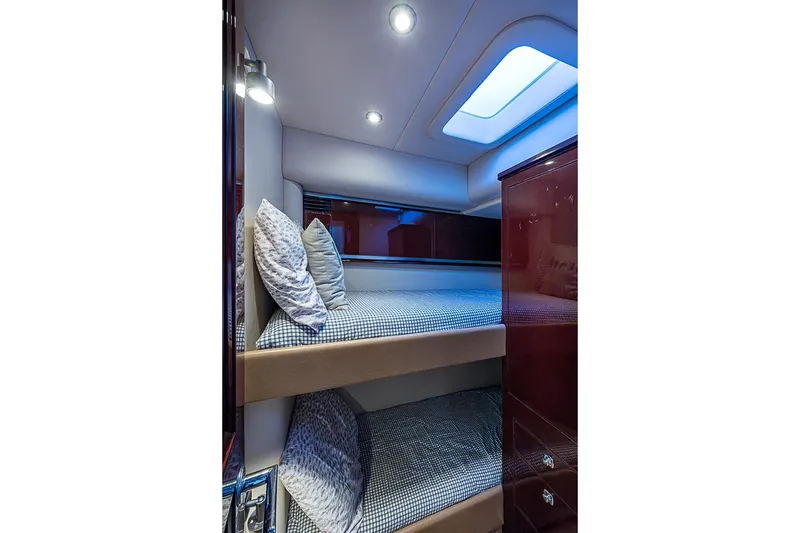 Slide: The Image of Luxurious cabin interior of 2010 Sea Ray 520 Sedan Bridge with bunk beds and ambient lighting. - 57