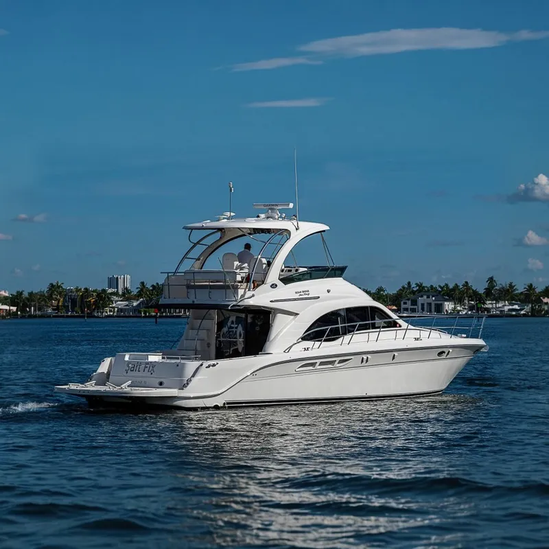 The Image of 2010 Sea Ray 520 Sedan Bridge yacht cruising on a sunny day. - 0