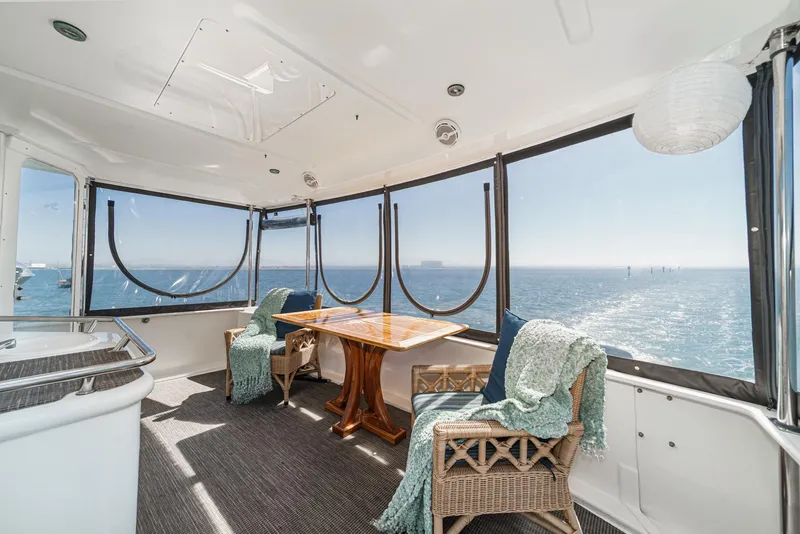 Slide: The Image of The 1999 Sea Ray 370 Aft Cabin features a spacious interior with panoramic ocean views. - 10