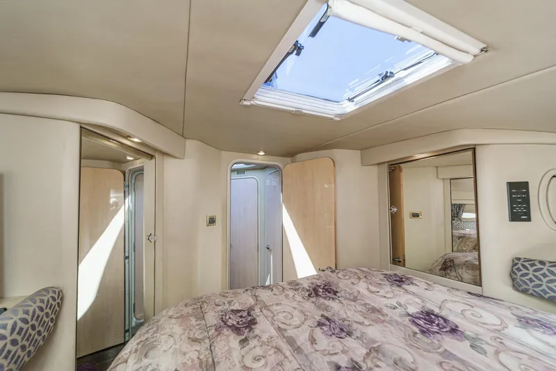 Slide: The Image of The image shows a cozy cabin with a large bed and a skylight. - 40