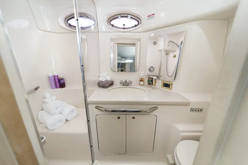 Slide: The Image of The bathroom of a 1999 Sea Ray 370 Aft Cabin with shower, sink, and toilet. - 45