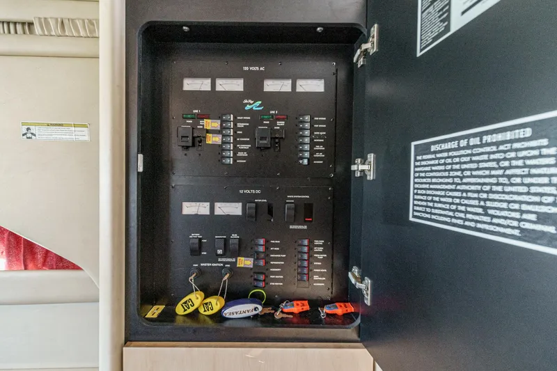 Slide: The Image of Electrical control panel inside a 1999 Sea Ray 370 Aft Cabin. - 46