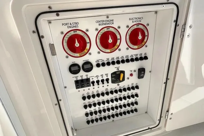 Slide: The Image of Electrical control panel on 2023 Pursuit OS 355 Offshore boat. - 19