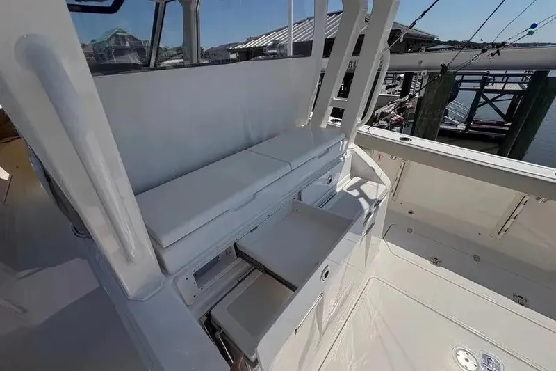 Slide: The Image of 2025 Pursuit S 328 Sport boat interior with seating and storage compartments. - 31