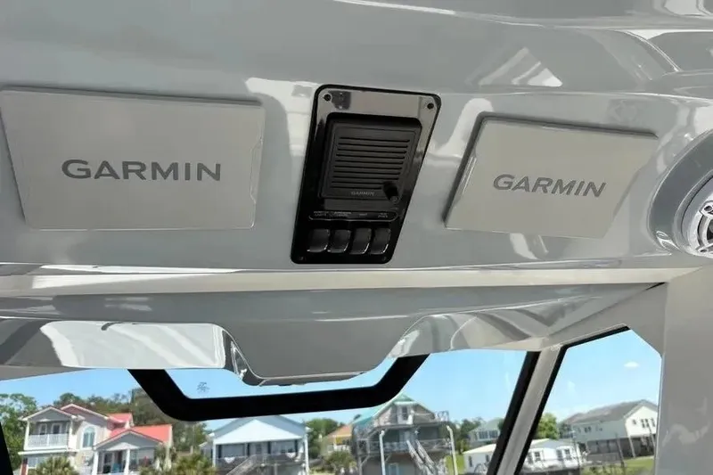 Slide: The Image of 2025 Pursuit S 328 Sport boat dashboard with Garmin electronics. - 16