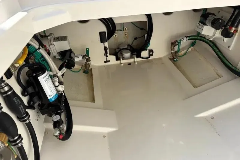 Slide: The Image of Interior view of 2025 Pursuit S 328 Sport boat's mechanical components and wiring. - 37