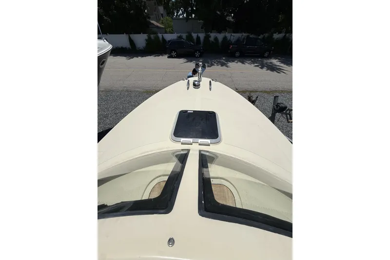 Slide: The Image of Bow view of 2018 Vanquish Bristol Harbor 23 boat, featuring deck hatch and windshield. - 7
