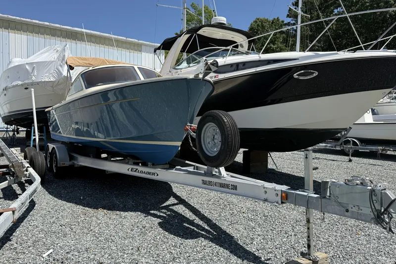 Slide: The Image of 2018 Vanquish Bristol Harbor 23 boat on trailer in storage yard. - 12