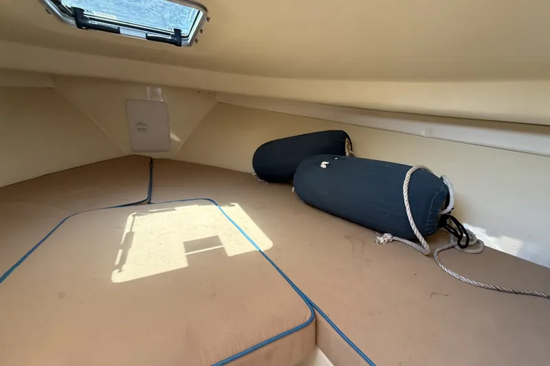Slide: The Image of Interior cabin of 2018 Vanquish Bristol Harbor 23 boat with cushions and fenders. - 9