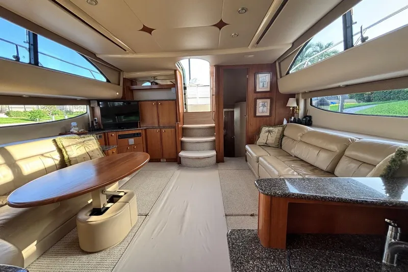 Slide: The Image of Luxurious interior of a 2004 Meridian 459 Motoryacht with plush seating and elegant wood finishes. - 5
