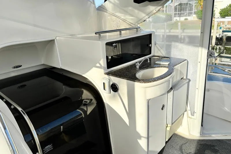 Slide: The Image of 2004 Meridian 459 Motoryacht interior with sink and storage area. - 2
