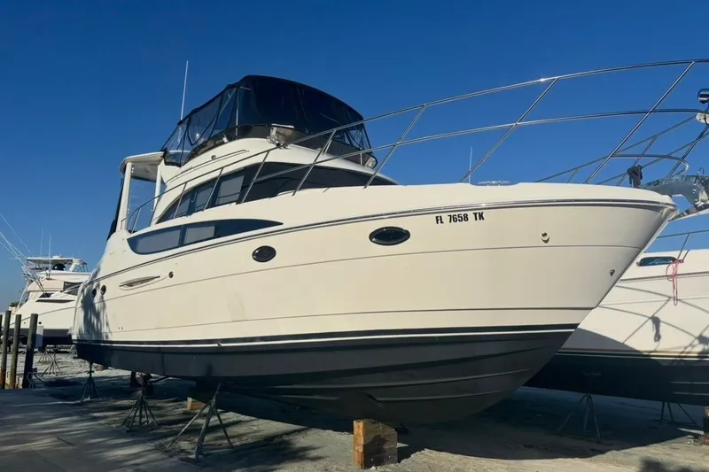 Slide: The Image of 2004 Meridian 459 Motoryacht on dry dock under clear blue sky. - 44