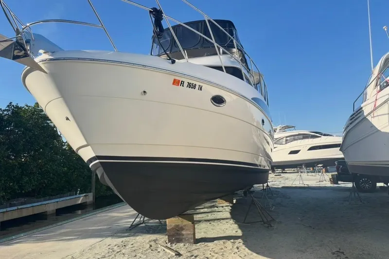 Slide: The Image of 2004 Meridian 459 Motoryacht on dry dock, showcasing sleek design and sturdy build. - 45