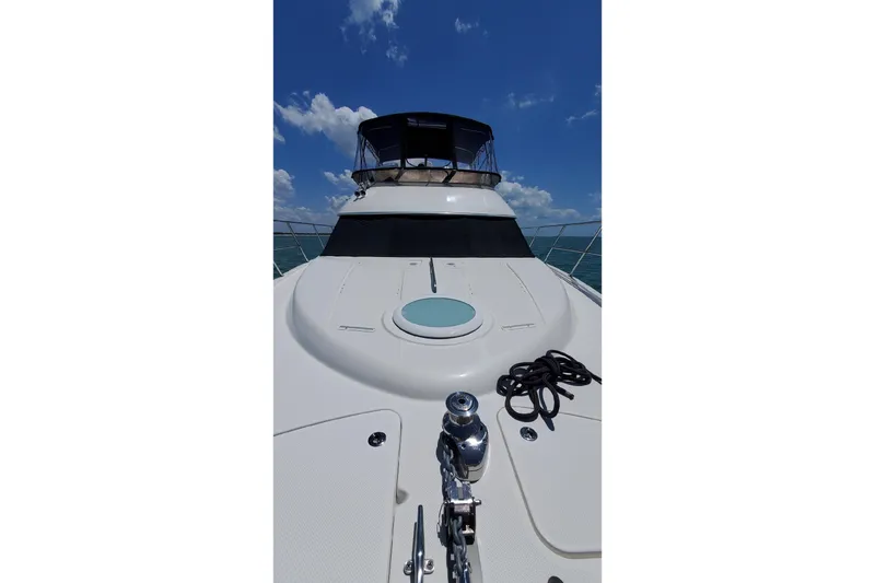 Slide: The Image of 2004 Meridian 459 Motoryacht deck view under clear blue sky. - 42