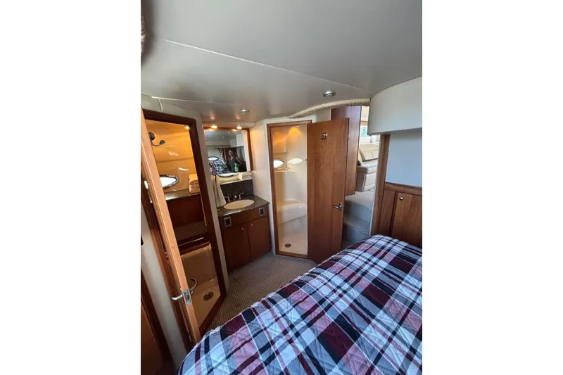 Slide: The Image of Interior of 2004 Meridian 459 Motoryacht with wood cabinetry and cozy bedroom. - 30