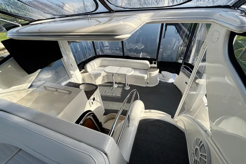 Slide: The Image of Luxurious interior of a 2004 Meridian 459 Motoryacht with elegant seating and panoramic windows. - 26