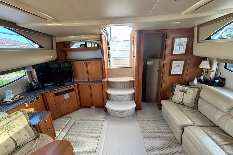 Slide: The Image of Luxurious interior of 2004 Meridian 459 Motoryacht with elegant wood cabinetry and plush seating. - 4