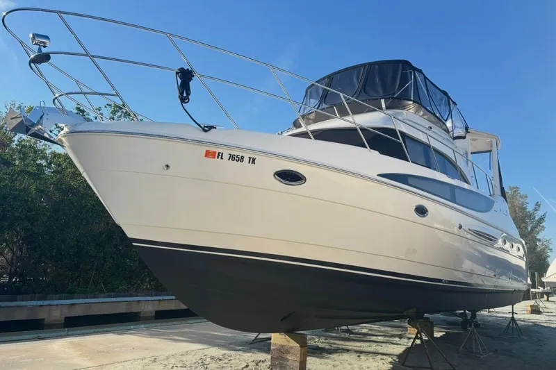 Slide: The Image of 2004 Meridian 459 Motoryacht on dry dock, showcasing sleek design and sturdy build. - 34