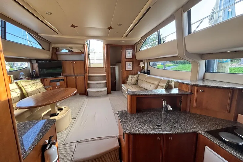Slide: The Image of Luxurious interior of 2004 Meridian 459 Motoryacht with elegant wood finishes and plush seating. - 17