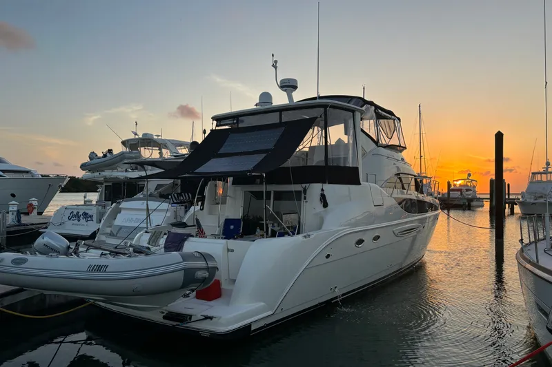 Slide: The Image of 2004 Meridian 459 Motoryacht docked at sunset, featuring sleek design and luxurious amenities. - 37