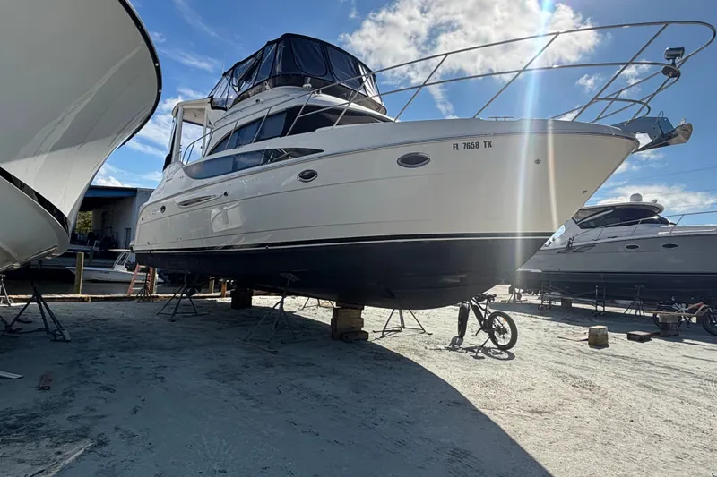 Slide: The Image of 2004 Meridian 459 Motoryacht on dry dock under a clear blue sky. - 35