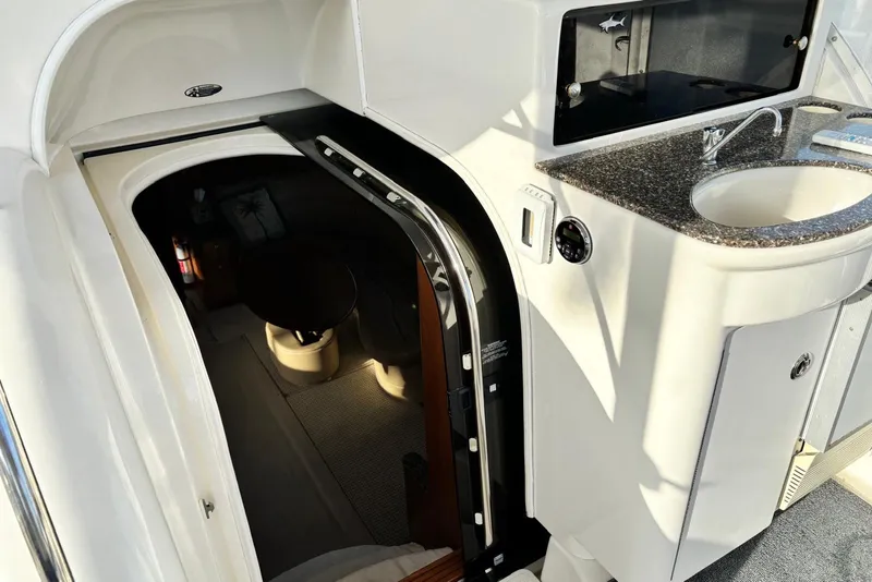 Slide: The Image of Interior view of 2004 Meridian 459 Motoryacht with sink and cabin entrance. - 13